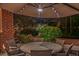 Backyard patio has a dining table and chairs with an umbrella and heater for outdoor gatherings at 1208 Wynnwood Ct, Mount Pleasant, SC 29464