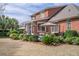 Backyard with an outdoor seating area with an umbrella and lush landscaping at 1208 Wynnwood Ct, Mount Pleasant, SC 29464