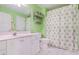 Bathroom with modern sink, toilet, a mirror, a towel rack, and a decorated shower curtain at 1208 Wynnwood Ct, Mount Pleasant, SC 29464