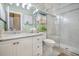 Charming bathroom showcasing wallpaper, marble countertops, and a glass-enclosed shower with detailed tiling at 1208 Wynnwood Ct, Mount Pleasant, SC 29464