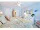 Comfortable bedroom featuring floral bedding, light blue walls, a dresser, and neutral carpeting at 1208 Wynnwood Ct, Mount Pleasant, SC 29464