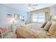 Comfortable bedroom featuring floral bedding, light blue walls, a dresser, and neutral carpeting at 1208 Wynnwood Ct, Mount Pleasant, SC 29464
