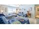 Light-filled bedroom with three twin beds, blue baseball-themed bedding, and neutral carpet at 1208 Wynnwood Ct, Mount Pleasant, SC 29464
