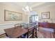 Elegant dining room with wood table, decorative rug, and chandelier lighting at 1208 Wynnwood Ct, Mount Pleasant, SC 29464