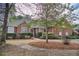 Charming single story brick home with manicured landscaping and inviting entrance during daylight at 1208 Wynnwood Ct, Mount Pleasant, SC 29464