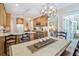 Inviting kitchen with wooden cabinets, marble countertops, and adjacent dining space at 1208 Wynnwood Ct, Mount Pleasant, SC 29464