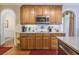 Modern kitchen with wooden cabinetry, updated appliances, and stylish backsplash at 1208 Wynnwood Ct, Mount Pleasant, SC 29464