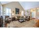 Bright living room with vaulted ceilings, large windows, and an inviting seating area at 1208 Wynnwood Ct, Mount Pleasant, SC 29464