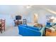 Spacious living room featuring vaulted ceilings, neutral carpet, and comfortable blue furniture with stylish decor at 1208 Wynnwood Ct, Mount Pleasant, SC 29464