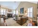 Spacious living area features a fireplace, vaulted ceilings, and an open floor plan at 1208 Wynnwood Ct, Mount Pleasant, SC 29464