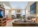Cozy living room boasts a fireplace, vaulted ceilings, and a comfortable leather sofa at 1208 Wynnwood Ct, Mount Pleasant, SC 29464