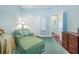 Cozy office nook features a comfortable green chair and a view of the hallway from the open doorway at 1208 Wynnwood Ct, Mount Pleasant, SC 29464