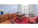 Traditional office with wooden furniture, a red rug, shutters on the window, and blue painted walls at 1208 Wynnwood Ct, Mount Pleasant, SC 29464
