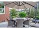 Outdoor dining area with a round table and umbrella, offering a perfect spot for al fresco meals at 1208 Wynnwood Ct, Mount Pleasant, SC 29464