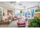 Relaxing sunroom with natural light, comfortable seating, and views of the outdoors at 1208 Wynnwood Ct, Mount Pleasant, SC 29464