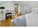 Bright bedroom featuring a desk, hardwood floors, and white trim at 127 Beresford Creek St, Charleston, SC 29492