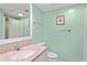 Bathroom with a cultured marble vanity, a toilet, and a tub/shower with a mint-green shower curtain at 1340 Pelican Watch Villas, Seabrook Island, SC 29455