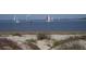 Sandy beach view with a variety of boats sailing in the ocean at 1340 Pelican Watch Villas, Seabrook Island, SC 29455
