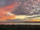 Beach view at dusk with red, orange and grey clouds at 1340 Pelican Watch Villas, Seabrook Island, SC 29455