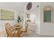 Bright dining area with seating for four, that is adjacent to the living area at 1340 Pelican Watch Villas, Seabrook Island, SC 29455