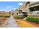 View of the back of the building, displaying decks, stairwells, and trimmed hedges at 1340 Pelican Watch Villas, Seabrook Island, SC 29455