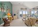 Sunlit living room featuring a sliding glass door to a deck with ocean views at 1340 Pelican Watch Villas, Seabrook Island, SC 29455