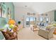 Cozy living room with vaulted ceilings and a door to the serene balcony at 1340 Pelican Watch Villas, Seabrook Island, SC 29455