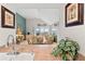 Bright living room with wicker furniture and an ocean view through sliding glass doors at 1340 Pelican Watch Villas, Seabrook Island, SC 29455