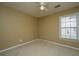 Bedroom showcasing neutral-toned walls, carpet flooring, ceiling fan, and natural light at 140 Moon Shadow Ln, Summerville, SC 29485