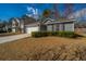 Exterior view of a home featuring a manicured lawn, driveway, and attached garage at 140 Moon Shadow Ln, Summerville, SC 29485
