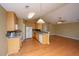 Bright and functional kitchen featuring wood cabinets and seamless access to the living area at 140 Moon Shadow Ln, Summerville, SC 29485