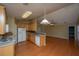Well-lit kitchen with wood cabinets, white appliances, and open flow to living space at 140 Moon Shadow Ln, Summerville, SC 29485