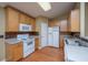Well-maintained kitchen with wood cabinets, white appliances, and a functional layout at 140 Moon Shadow Ln, Summerville, SC 29485