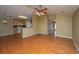 Open-concept living space with hardwood floors and seamless access to the kitchen at 140 Moon Shadow Ln, Summerville, SC 29485