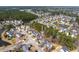 Aerial view showcases the residential area with ponds, mature trees, and winding streets at 1441 Thayer Pl, Mount Pleasant, SC 29466