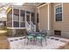 Backyard patio with outdoor seating area and access to the screened porch at 1441 Thayer Pl, Mount Pleasant, SC 29466