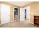 Neutral bedroom featuring carpet, a built-in shelf, and access to a full bathroom at 1441 Thayer Pl, Mount Pleasant, SC 29466