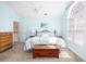 Bright bedroom with a ceiling fan, a large arched window, and neutral decor at 1441 Thayer Pl, Mount Pleasant, SC 29466