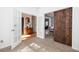 Cozy bonus room features a sliding barn door, carpeted floors, and French doors at 1441 Thayer Pl, Mount Pleasant, SC 29466