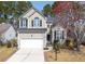 Charming two-story home with manicured lawn, attached garage, and lovely landscaping at 1441 Thayer Pl, Mount Pleasant, SC 29466