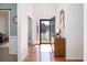 Bright foyer features hardwood floors, white walls, and light from the glass front door at 1441 Thayer Pl, Mount Pleasant, SC 29466