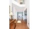 Bright foyer featuring hardwood floors, white walls, and a view into a dining room at 1441 Thayer Pl, Mount Pleasant, SC 29466