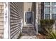 Inviting front entrance with wood-look steps and a glass-paneled door at 1441 Thayer Pl, Mount Pleasant, SC 29466