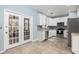 Open-concept kitchen with stainless steel appliances and access to patio at 1441 Thayer Pl, Mount Pleasant, SC 29466