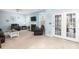 Bright living room with fireplace and access to outdoor patio at 1441 Thayer Pl, Mount Pleasant, SC 29466