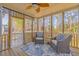Relaxing screened porch with comfortable seating and ceiling fan at 1441 Thayer Pl, Mount Pleasant, SC 29466