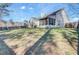 Spacious backyard featuring a screened-in porch and a well-maintained lawn, great for outdoor living at 1473 Coopers Hawk Dr, Hanahan, SC 29410