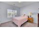 Cozy bedroom featuring carpet, a plush bed, and natural light from a large window at 1473 Coopers Hawk Dr, Hanahan, SC 29410