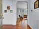 Inviting entryway with hardwood floors, light blue walls and an arched doorway leading to the living area at 1473 Coopers Hawk Dr, Hanahan, SC 29410