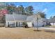 Attractive single-story house with a two-car garage, front garden, and a well-manicured lawn at 1473 Coopers Hawk Dr, Hanahan, SC 29410